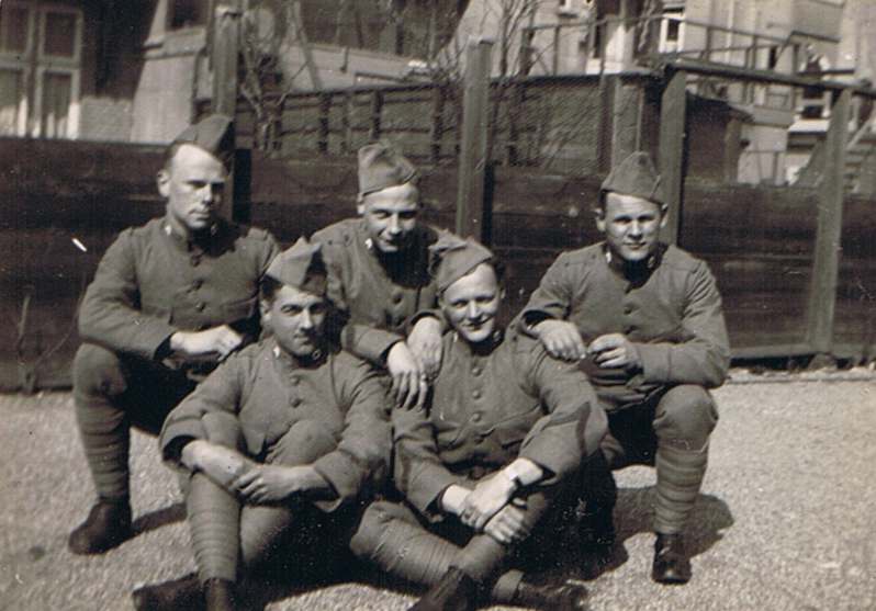 My father is on the left of this picture, in the front row.  Note the red cross emblem on his collar, showing his service in the Medical Troops.